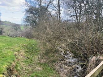 A three bedroom character cottage in a charming rural location on the outskirts of Llanrhaeadr Ym Mochnant with views over the surrounding countryside and offering scope for improvement.