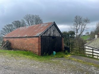 A three bedroom character cottage in a charming rural location on the outskirts of Llanrhaeadr Ym Mochnant with views over the surrounding countryside and offering scope for improvement.