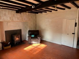 A three bedroom character cottage in a charming rural location on the outskirts of Llanrhaeadr Ym Mochnant with views over the surrounding countryside and offering scope for improvement.
