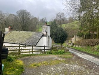 A three bedroom character cottage in a charming rural location on the outskirts of Llanrhaeadr Ym Mochnant with views over the surrounding countryside and offering scope for improvement.