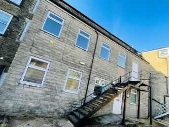 Mason Chambers presents a compelling investment opportunity located on Manchester Road in the bustling town of Haslingden. This versatile property offers a prominent high street position in a well-established commercial area, ideal for a range of business uses.