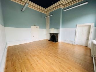 Mason Chambers presents a compelling investment opportunity located on Manchester Road in the bustling town of Haslingden. This versatile property offers a prominent high street position in a well-established commercial area, ideal for a range of business uses.