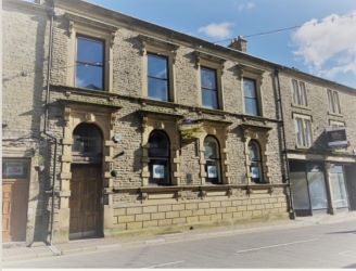 Mason Chambers presents a compelling investment opportunity located on Manchester Road in the bustling town of Haslingden. This versatile property offers a prominent high street position in a well-established commercial area, ideal for a range of business uses.