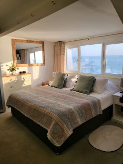 A thrilling chance to own a prime beachfront property with vast potential for future development!