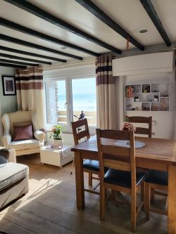 A thrilling chance to own a prime beachfront property with vast potential for future development!