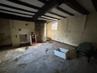 This remarkable opportunity includes an imposing Grade II Listed Building, previously used as offices, with approved planning permission for conversion into a stunning 5-bedroom residence spread across three floors. Additionally, planning consent has been granted to transform the existing garage outbuilding into a charming single-story, 2-bedroom detached home.