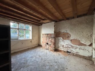 This remarkable opportunity includes an imposing Grade II Listed Building, previously used as offices, with approved planning permission for conversion into a stunning 5-bedroom residence spread across three floors. Additionally, planning consent has been granted to transform the existing garage outbuilding into a charming single-story, 2-bedroom detached home.