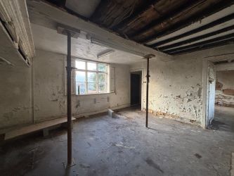 This remarkable opportunity includes an imposing Grade II Listed Building, previously used as offices, with approved planning permission for conversion into a stunning 5-bedroom residence spread across three floors. Additionally, planning consent has been granted to transform the existing garage outbuilding into a charming single-story, 2-bedroom detached home.