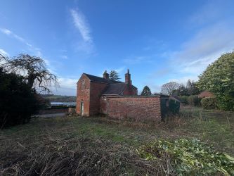 This remarkable opportunity includes an imposing Grade II Listed Building, previously used as offices, with approved planning permission for conversion into a stunning 5-bedroom residence spread across three floors. Additionally, planning consent has been granted to transform the existing garage outbuilding into a charming single-story, 2-bedroom detached home.