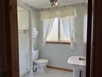 Town and Country Property Auctions proudly presents Polcraig Guest House, a modern detached property nestled in the heart of Lochinver, Scotland.