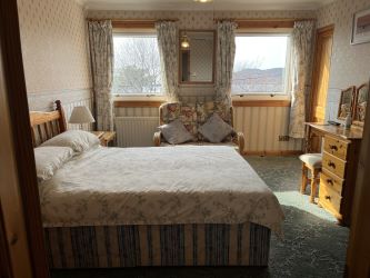 Town and Country Property Auctions proudly presents Polcraig Guest House, a modern detached property nestled in the heart of Lochinver, Scotland.