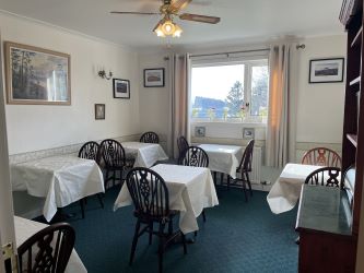 Town and Country Property Auctions proudly presents Polcraig Guest House, a modern detached property nestled in the heart of Lochinver, Scotland.