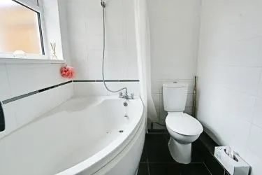 THIS INCOME GENERATING MID TERRACE PROPERTY IS