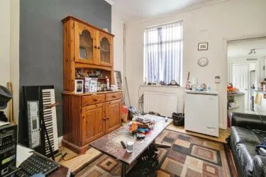 THIS INCOME GENERATING MID TERRACE PROPERTY IS
