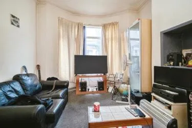 THIS INCOME GENERATING MID TERRACE PROPERTY IS
