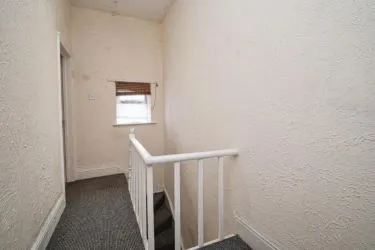 THIS INCOME GENERATING MID TERRACE PROPERTY IS