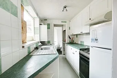 THIS INCOME GENERATING MID TERRACE PROPERTY IS