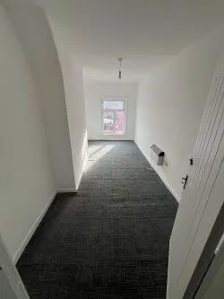 Mixed - Use Building: Commercial shop use class on the ground floor, with a part converted uppers to a 3 bed residential flat. Requires physical separation with a stud wall from commercial to residential.