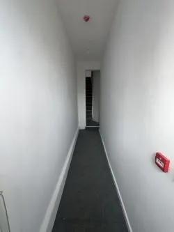 Mixed - Use Building: Commercial shop use class on the ground floor, with a part converted uppers to a 3 bed residential flat. Requires physical separation with a stud wall from commercial to residential.