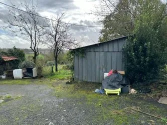 2 Bedroom stone cottage to finish renovating with outbuildings and almost 2 acres of land.