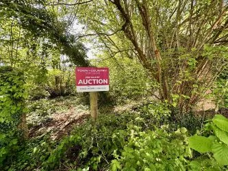 A rare and exciting opportunity to acquire a parcel of picturesque riverside land nestled alongside the tranquil River Nadder and overlooking Harnham Water Meadows. - Riverside Land Opposite, 45-49 Lower Road, Salisbury, Wiltshire, SP2 9NF