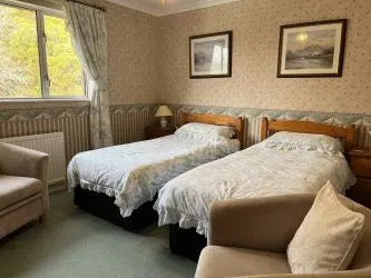Town and Country Property Auctions proudly presents Polcraig Guest House, a modern detached property nestled in the heart of Lochinver, Scotland.