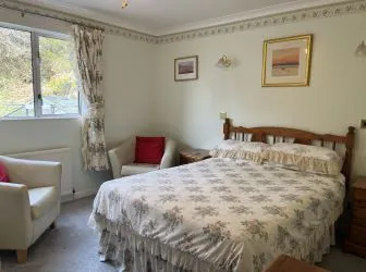 Town and Country Property Auctions proudly presents Polcraig Guest House, a modern detached property nestled in the heart of Lochinver, Scotland.