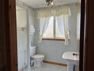 Town and Country Property Auctions proudly presents Polcraig Guest House, a modern detached property nestled in the heart of Lochinver, Scotland.