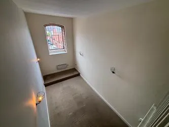 Offered to the market via auction is this unique and spacious loft-style duplex apartment, set within the impressive Grade II listed Tean Hall Mills development. Converted in 2013 to a high standard, the property is situated in the former Warehouse building and retains many original features including exposed beams, cast iron pillars, and vaulted ceilings.