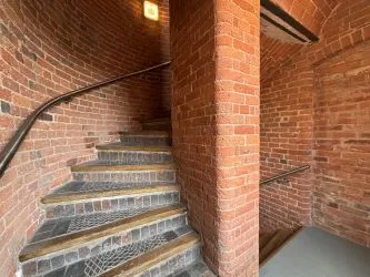 Offered to the market via auction is this unique and spacious loft-style duplex apartment, set within the impressive Grade II listed Tean Hall Mills development. Converted in 2013 to a high standard, the property is situated in the former Warehouse building and retains many original features including exposed beams, cast iron pillars, and vaulted ceilings.