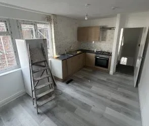 Mixed - Use Building: Commercial shop use class on the ground floor, with a part converted uppers to a 3 bed residential flat. Requires physical separation with a stud wall from commercial to residential.