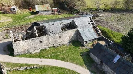 A farm house set in 9.56 acres with an extensive range of barns providing great potential for development.