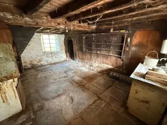 A farm house set in 9.56 acres with an extensive range of barns providing great potential for development.