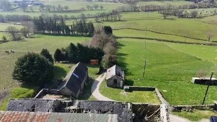 A farm house set in 9.56 acres with an extensive range of barns providing great potential for development.