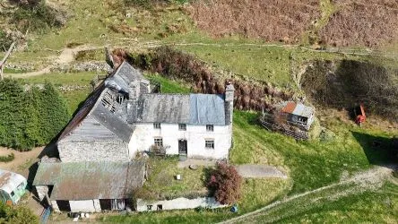 A farm house set in 9.56 acres with an extensive range of barns providing great potential for development.