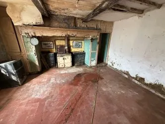 A farm house set in 9.56 acres with an extensive range of barns providing great potential for development.