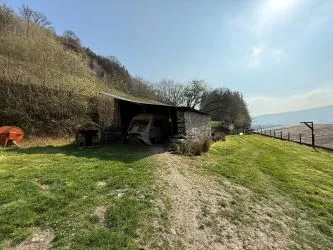 A farm house set in 9.56 acres with an extensive range of barns providing great potential for development.