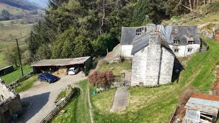 A farm house set in 9.56 acres with an extensive range of barns providing great potential for development.