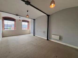 Offered to the market via auction is this unique and spacious loft-style duplex apartment, set within the impressive Grade II listed Tean Hall Mills development. Converted in 2013 to a high standard, the property is situated in the former Warehouse building and retains many original features including exposed beams, cast iron pillars, and vaulted ceilings.