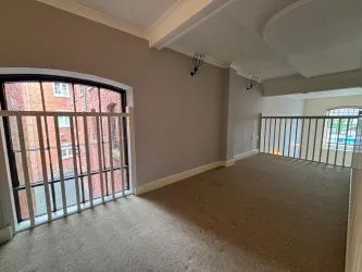Offered to the market via auction is this unique and spacious loft-style duplex apartment, set within the impressive Grade II listed Tean Hall Mills development. Converted in 2013 to a high standard, the property is situated in the former Warehouse building and retains many original features including exposed beams, cast iron pillars, and vaulted ceilings.