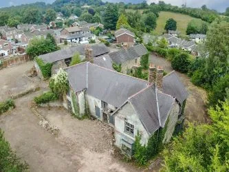 A Superb Plot Located In A Popular Residential Area Of Wrexham And Comprising The Grade II* Listed Plas Newydd together with a number of later buildings and outbuildings and large grounds. An Opportunity To Create A Significant Development, Subject To Consents.