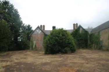 A Superb Plot Located In A Popular Residential Area Of Wrexham And Comprising The Grade II* Listed Plas Newydd together with a number of later buildings and outbuildings and large grounds. An Opportunity To Create A Significant Development, Subject To Consents.
