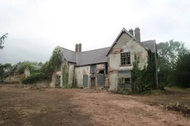 A Superb Plot Located In A Popular Residential Area Of Wrexham And Comprising The Grade II* Listed Plas Newydd together with a number of later buildings and outbuildings and large grounds. An Opportunity To Create A Significant Development, Subject To Consents.