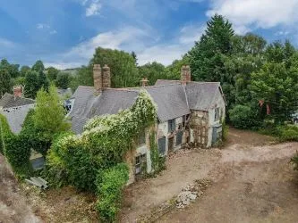 A Superb Plot Located In A Popular Residential Area Of Wrexham And Comprising The Grade II* Listed Plas Newydd together with a number of later buildings and outbuildings and large grounds. An Opportunity To Create A Significant Development, Subject To Consents.