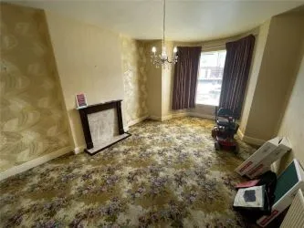 A two bedroom ground floor apartment in need of refurbishment.