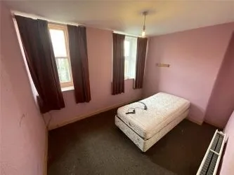 A two bedroom ground floor apartment in need of refurbishment.
