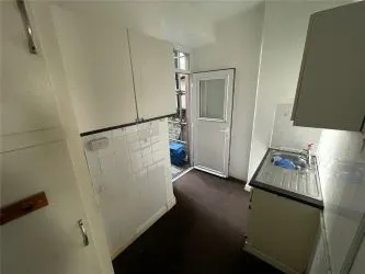 A two bedroom ground floor apartment in need of refurbishment.