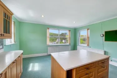 A Landmark Coastal Residence with Untapped Potential and Panoramic Sea Views!