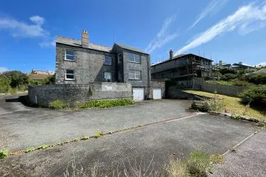 A Landmark Coastal Residence with Untapped Potential and Panoramic Sea Views!