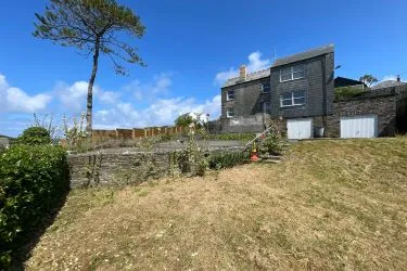 A Landmark Coastal Residence with Untapped Potential and Panoramic Sea Views!